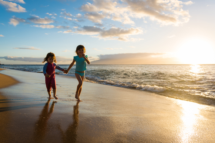 Cute siblings strolling in one of Paia beaches